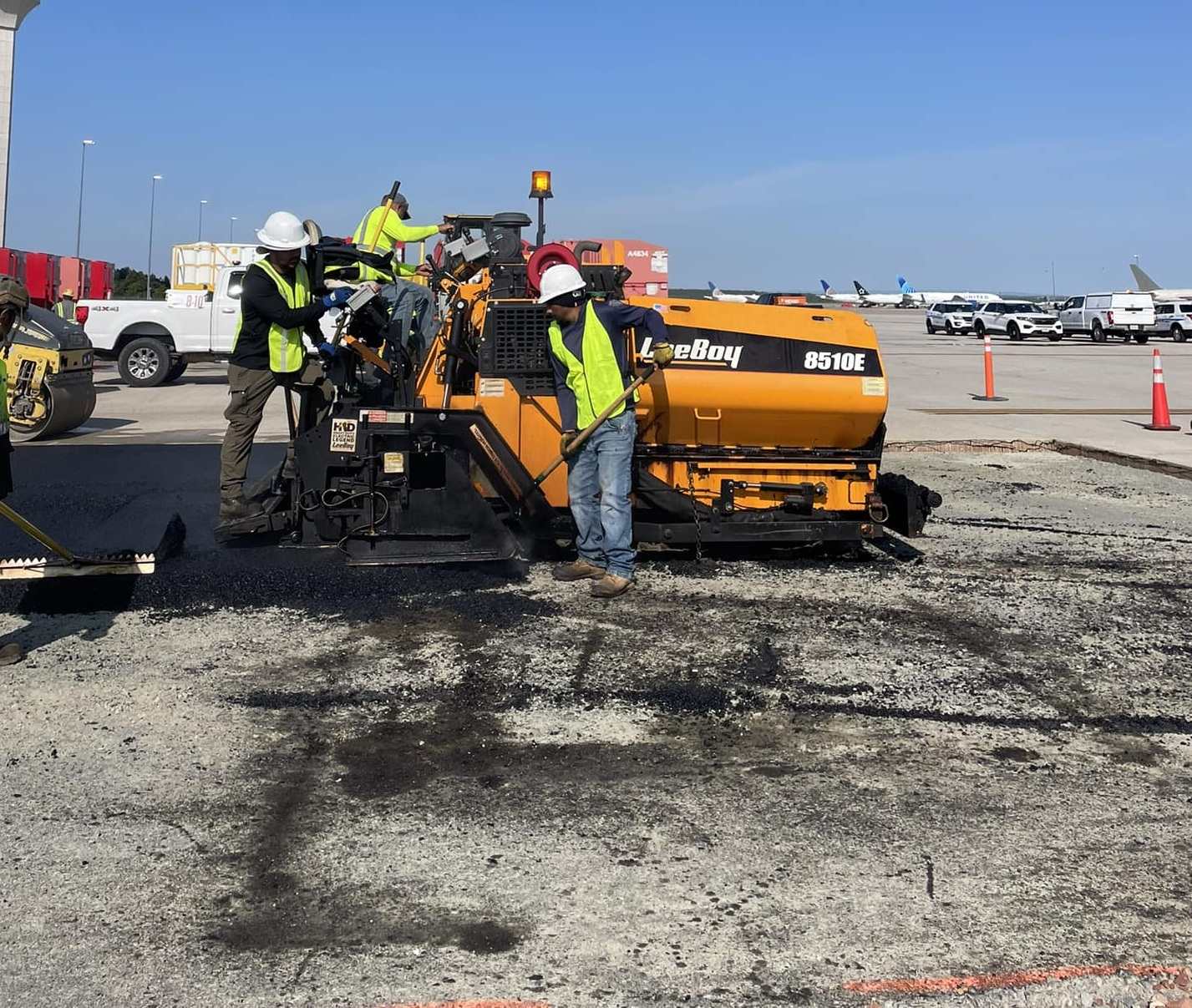 Multi-bay commercial garage with fresh asphalt surface