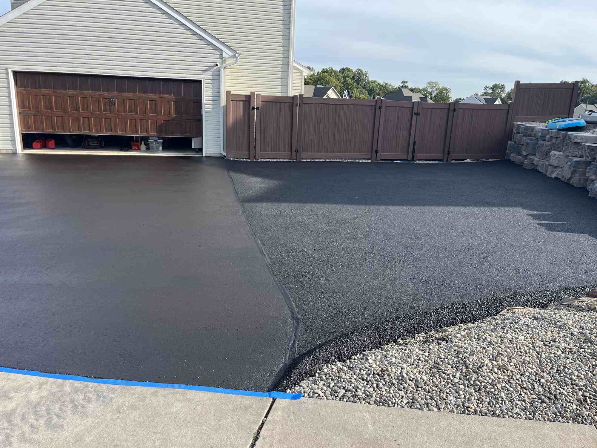 Fresh driveway next to garage